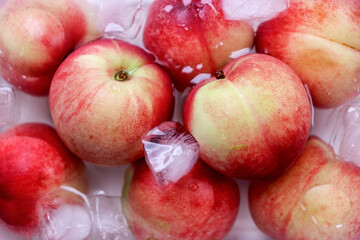 Organic Nectarines. Ripe, juicy organic Nectarines(peaches) in ice water.