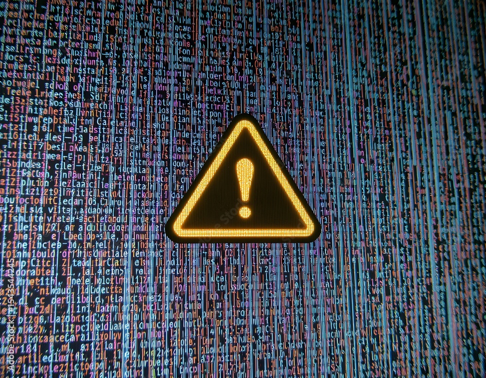 Poster warning sign on technological background: a high-angle shot features a yellow hazard warning sign wi