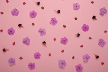 Floral pattern of flowers and roses, green leaves, branches on beige background. Flat layer, top view. Valentine's background. Floral pattern. Floral pattern. Floral pattern texture