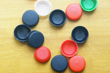 Top view of plastic bottle lids for recycling education. Waste management awareness, eco...