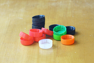 Plastic caps close-up as symbol of recycling education. Waste awareness for schools and families, environmental responsibility, reuse of plastic goods and sustainable future concept in everyday life.