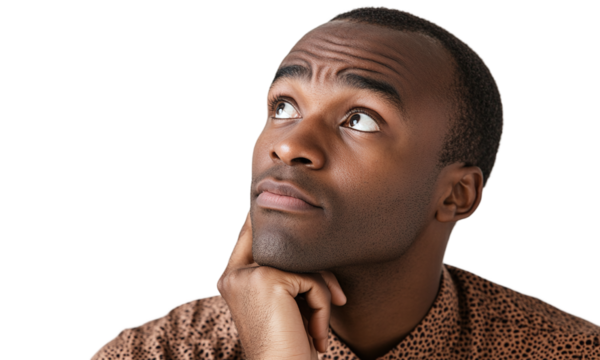 Portrait of an african-american guy looking up and thinking with a serious expression, isolated on a transparent background.