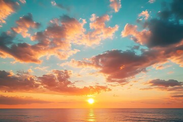 Fototapeta premium Stunning Sunset Over Ocean with Clouds Lit in Golden and Orange Colors