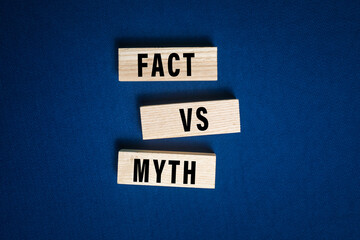 myths and facts words text message on wooden blocks on dark blue background