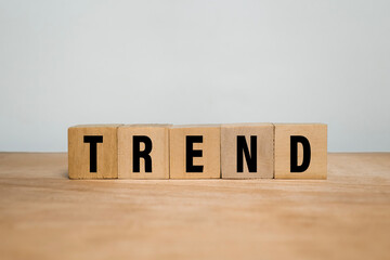 trend words text on wooden blocks on wooden surface
