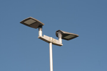 Modern led street lights illuminating the night sky