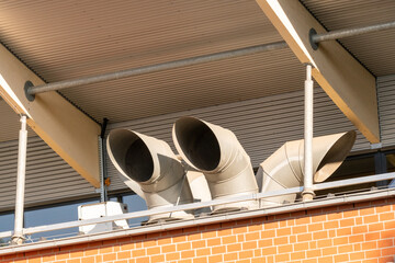 Industrial ventilation system extracting air on building roof