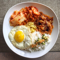 Korean breakfast: kimchi, rice, egg, and soy-based protein
