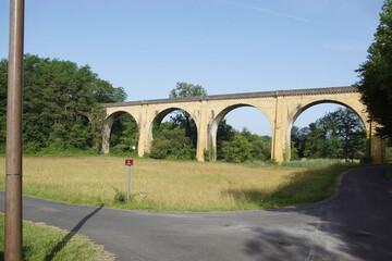 Viaduct near the French village of Proissans in the Dordogne. Narrow roads, forests, meadows. Summer, June. France.  