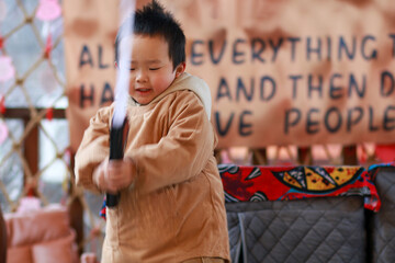 little boy with a toy sword
