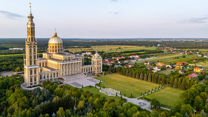 Aerial view of the Basilica of Our Lady of Licheń in Licheń Stary, surrounded by greenery and...