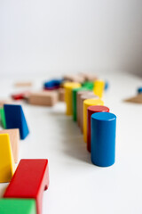 Colorful wooden blocks arranged on white surface