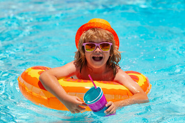 Funny kids face. Kid boy swimming in pool play with floating ring. Smiling cute kid in sunglasses...
