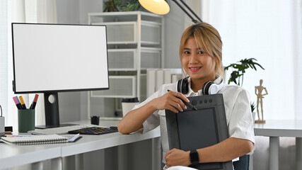 Portrait of a Confident Graphic Designer Woman at Workspace