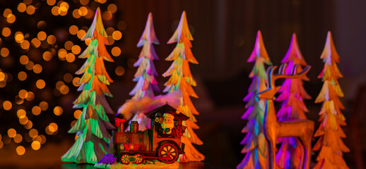 Santa Claus, New Years, Christmas card. Santa on the Christmas tree background. Christmas pine tree. Christmas decorations for the new year. Santa in train. New Year background with Santa.