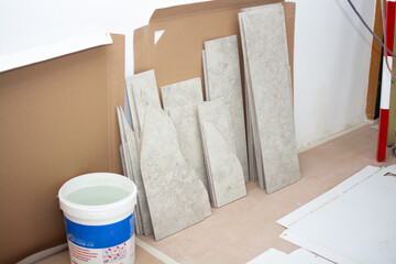 Ceramic tile cuts after laying. Construction process.