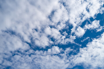 Sunny cloudy skies. Cumulus clouds in sky. Cloud wallpaper. Sky background. Cloudy sky with...