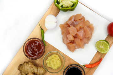 Preparation ingredients ( lime, chilies, onion, garlic, coriander root, galangal and lemon grass)...