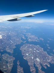 View from a plane passing over the frozen landscape of northern Canada and the Labrador Sea.