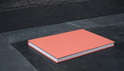 Notebook with pen and coffee cup and flowers on grey
