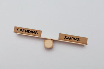 Balance between savings and spending the concept of saving is heavier or more necessary than spending