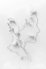 Profile silhouettes of two heads with delicate white flowers