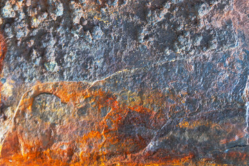 Peeling rust and oxidation on steel. Rough industrial grunge background.