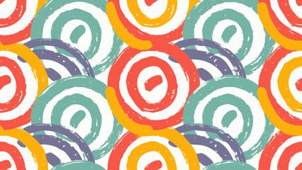 Seamless pattern of colorful brush stroke circles overlapping each other on a white textured background
