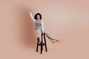 Confident African American businesswoman in stylish professional attire posing confidently on a...