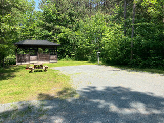 A campground site with boxes for horses