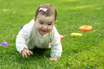 baby girl crawling looking at camera