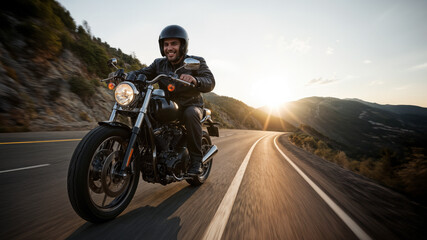 Smiling motorcyclist riding on a winding road at high speed during a vibrant sunset, evoking freedom and adventure.