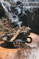 Burning Sage And Palo Santo With Rising Smoke