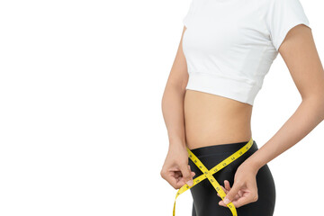 Diet and dieting. Beauty slim female body use tape measure. Woman in exercise clothes achieves...