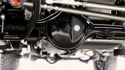 Car suspension part. Close up of a rear car suspension and exhaust system. such as coil springs...