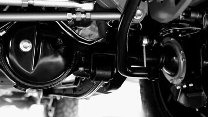 Car suspension part. Close up of a rear car suspension and exhaust system. such as coil springs...