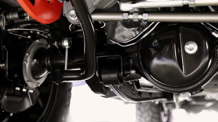 Car suspension part. Close up of a rear car suspension and exhaust system. such as coil springs...