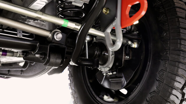 Car suspension part. Close up of a rear car suspension and exhaust system. such as coil springs link arms axle housing and performance exhaust. For auto engineering or car suspension part industry use