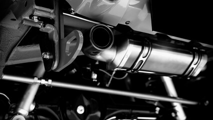 Car suspension part. Close up of a rear car suspension and exhaust system. such as coil springs...