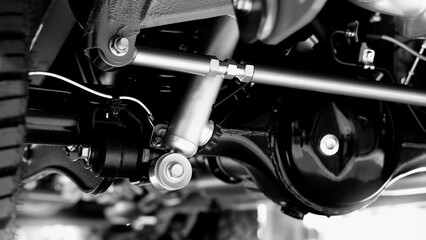 Car suspension part. Close up of a rear car suspension and exhaust system. such as coil springs...