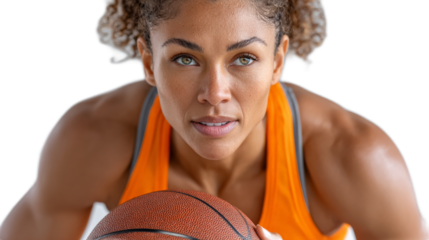 Focused Female Basketball Player: An determined woman poised and ready to dominate the court. With the basketball in her grip, her intensity and focus show unwavering dedication to the game.