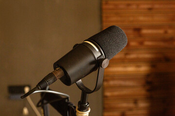 black studio microphone on dark background