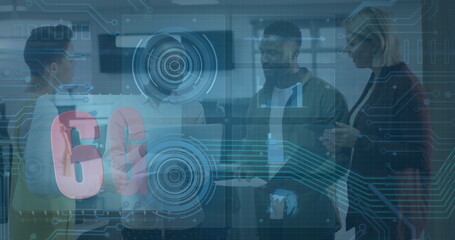 Collaborating group of four professionals using tablet in modern tech office, with 6G graphics