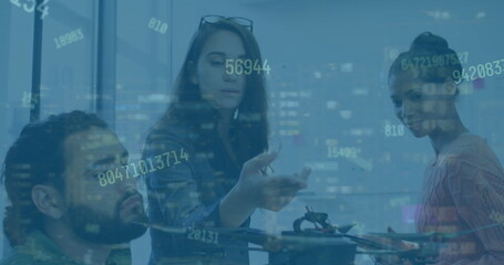 Collaborating 3 engineers analyzing quadcopter drone at office workspace with data overlay