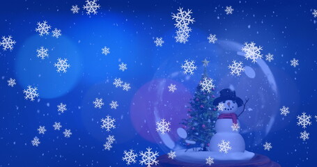 Displaying glass snow globe resting on wooden base in winter scene, with tree, snowman, copy space
