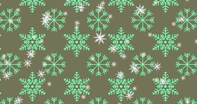 Fototapeta Displaying repeating mint green snowflake motifs and smaller white snowflakes on olive green fabric