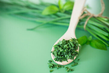 Top view of dried herbs and fresh green onions