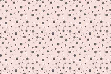 Beautiful seamless pattern of gray uneven polka dots on  delicate pink background. Abstract spots. For backgrounds, wallpapers, textiles, packaging, or  website.
