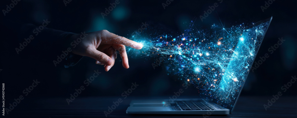 Poster a hand reaches toward a laptop, creating a stunning display of light and data particles, symbolizing