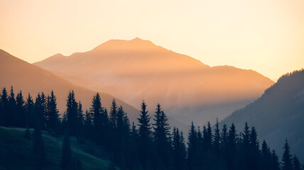 Obraz premium Sunset over majestic mountains with a line of trees
